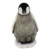 (image for) Baby Stands Watching Penguin Figurine
