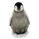 (image for) Baby Stands Watching Penguin Figurine